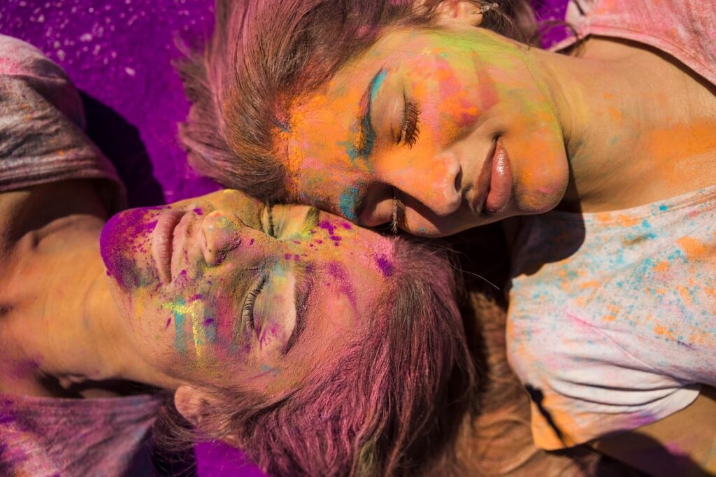 The faces of two girls are painted