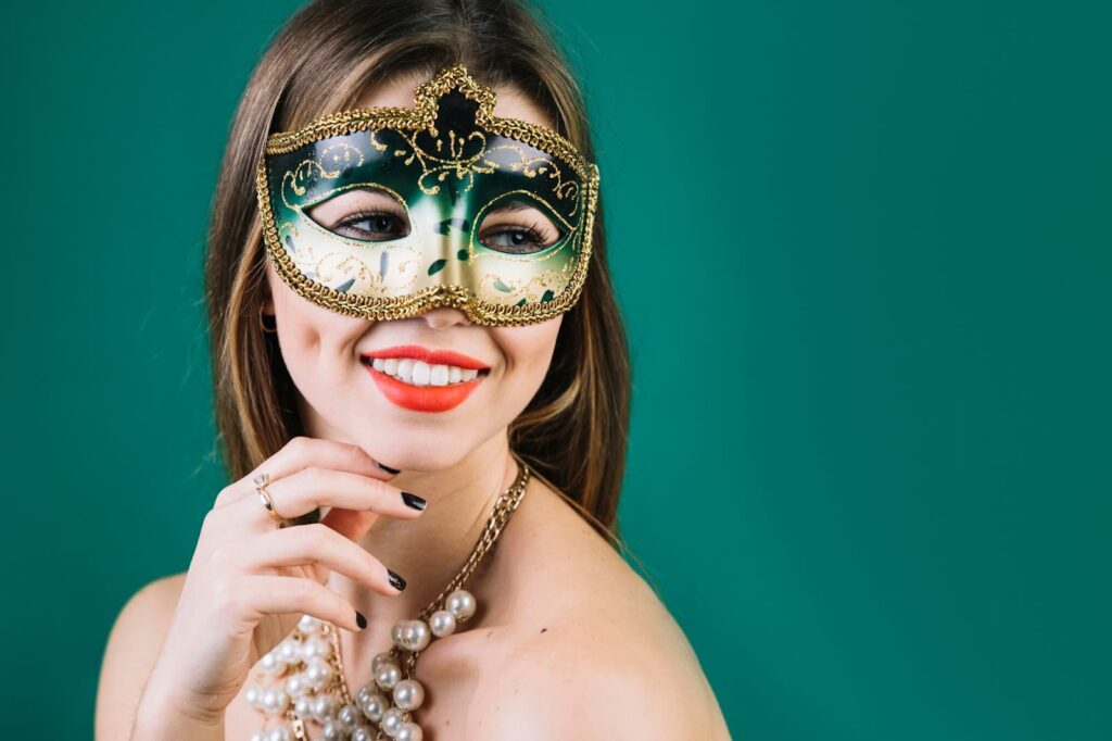 Smiling woman wearing masquerade carnival mask